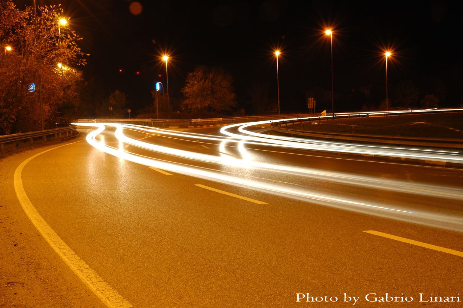 Cars at night on a roundabout in city
