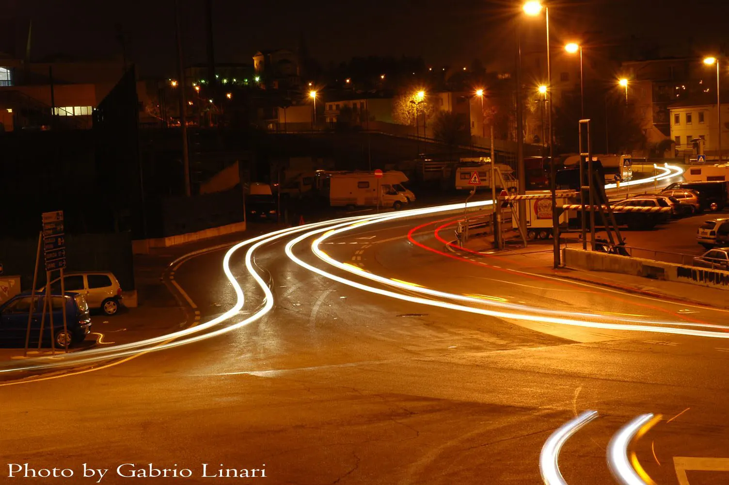Night shots of cars on a curve at night